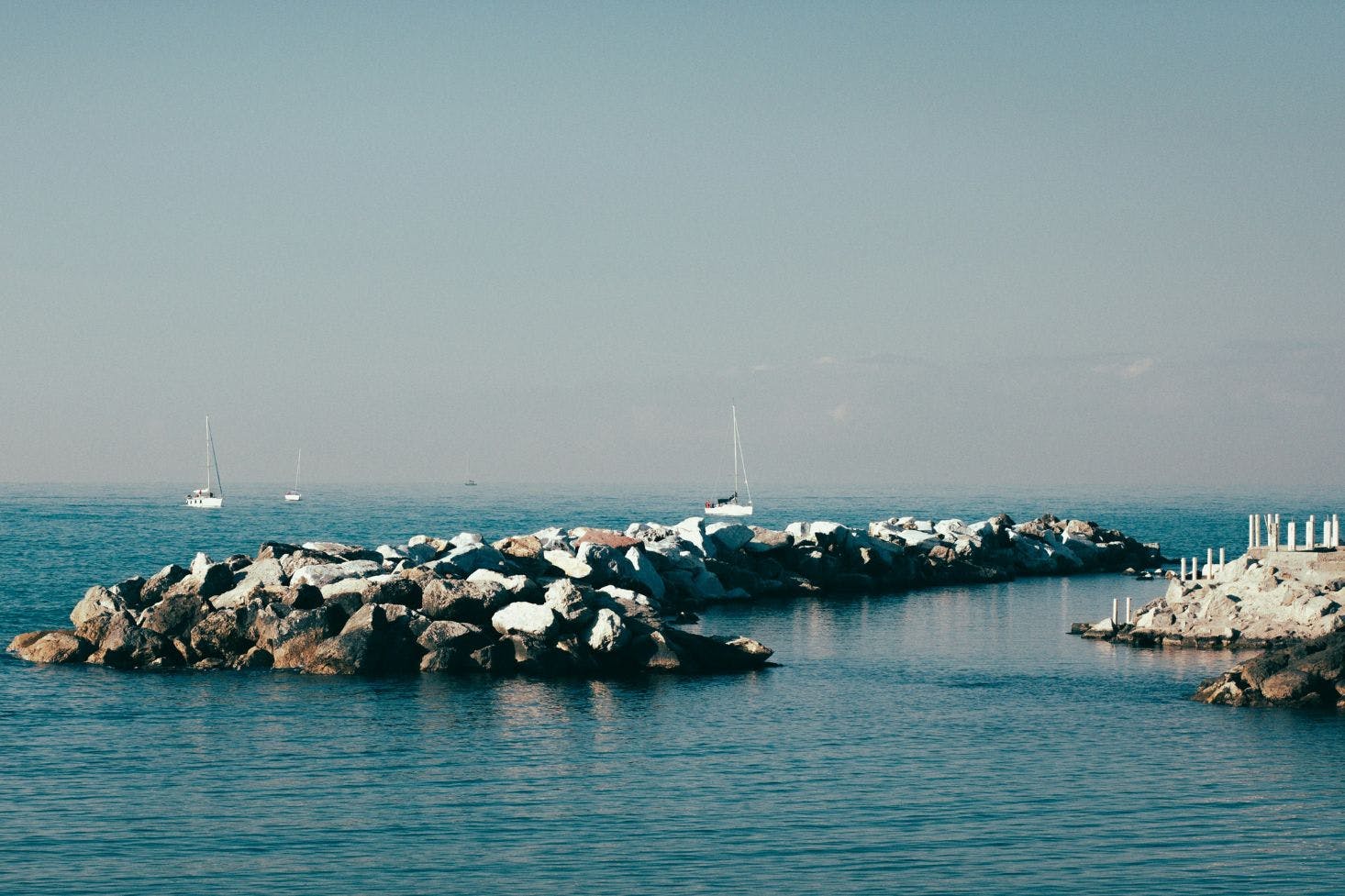 Rocky Marina di Pisa, Italy with the boats on the horizon