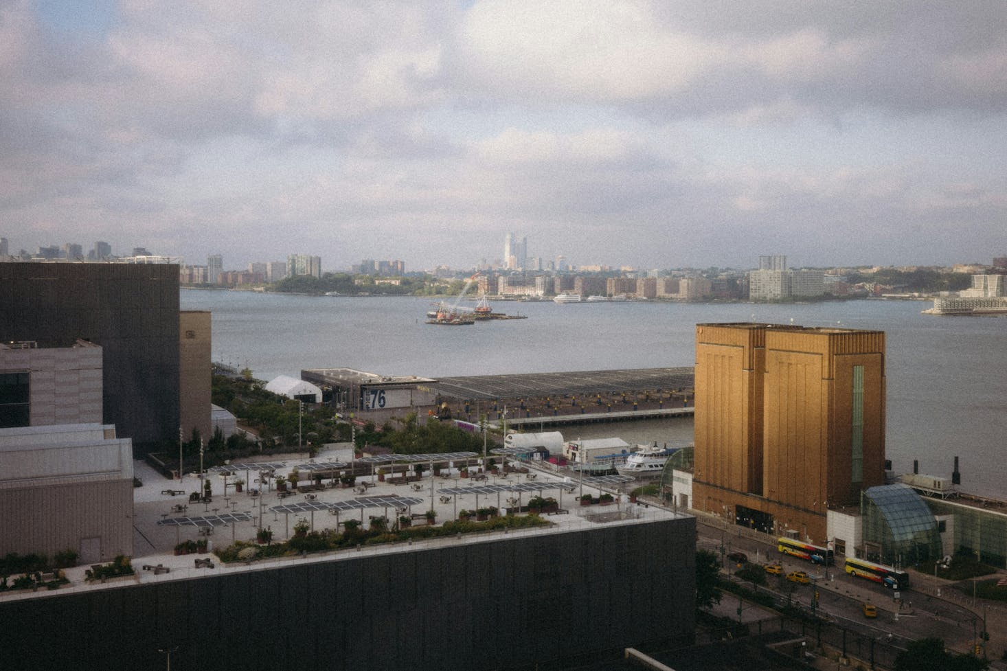 View of the Hudson River over rooftops in NYC's Hell's Kitchen