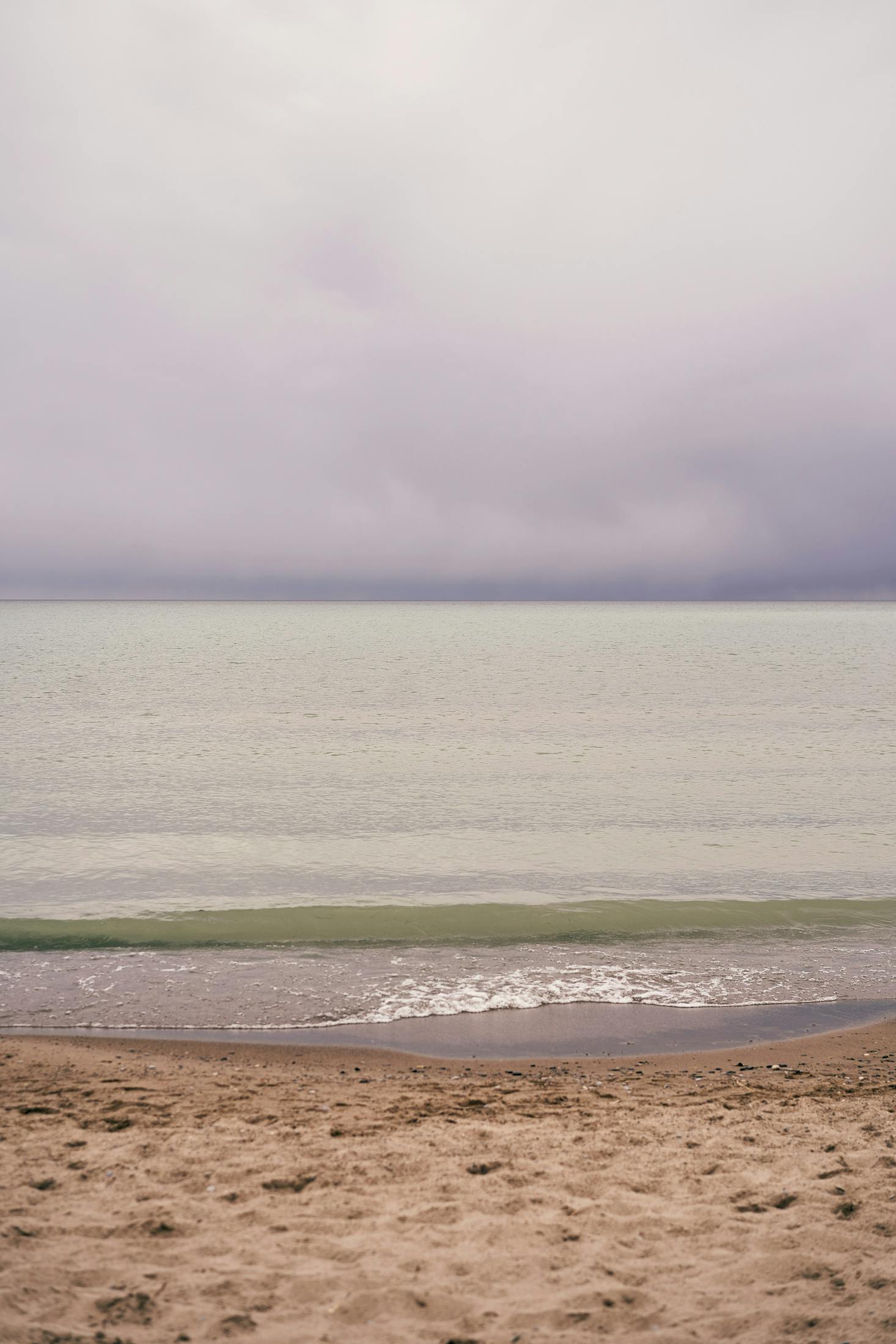 Golden sand at a beach near Toronto on a cloudy and stormy day