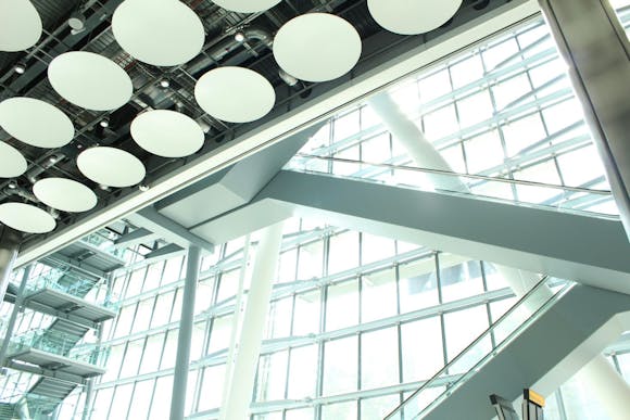 View of the ceilings and huge windows at Terminal 5 of Heathrow Airport, London, showcasing modern architecture