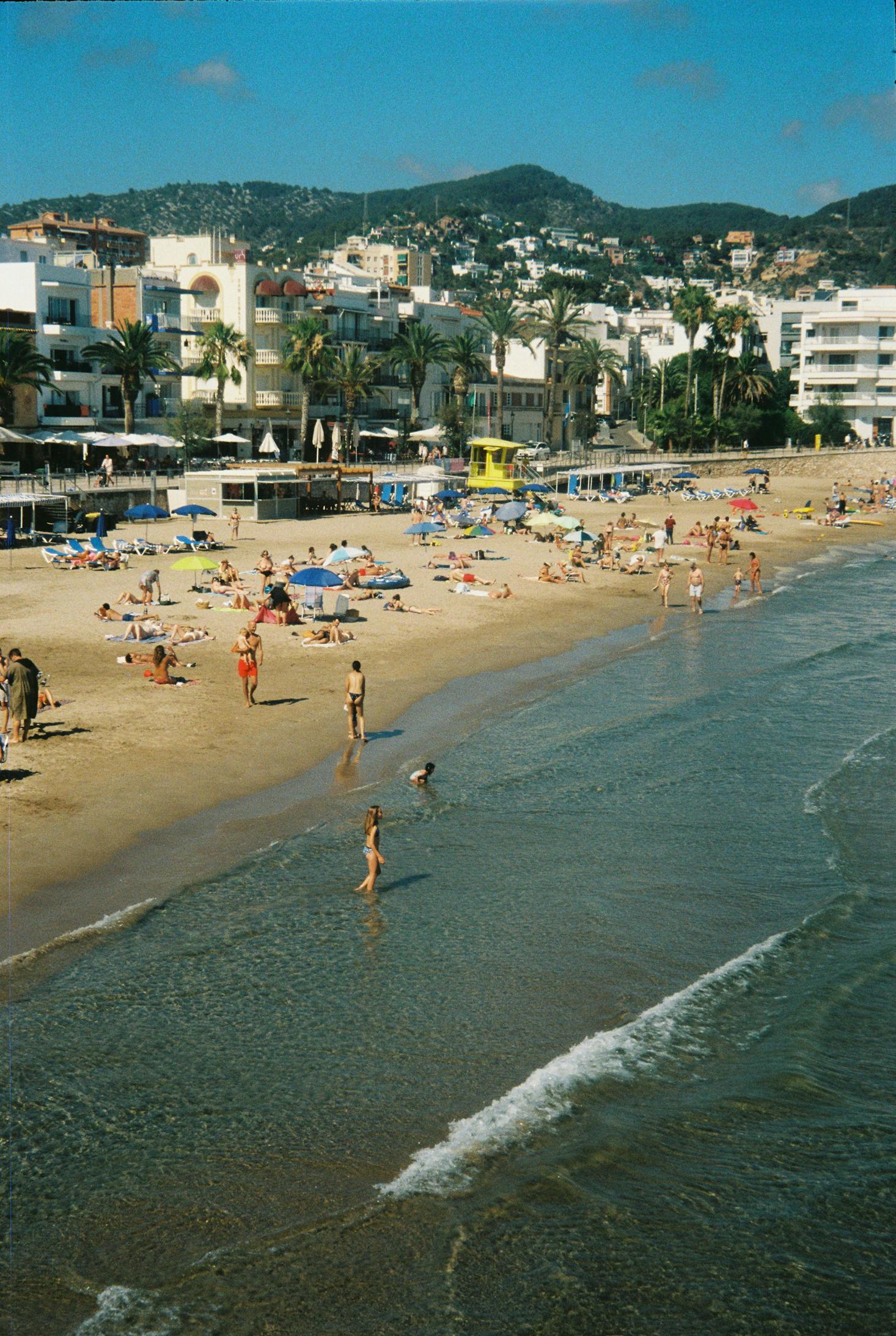 The resort area of Sitges near Barcelona with golden sand and hotels along the shore