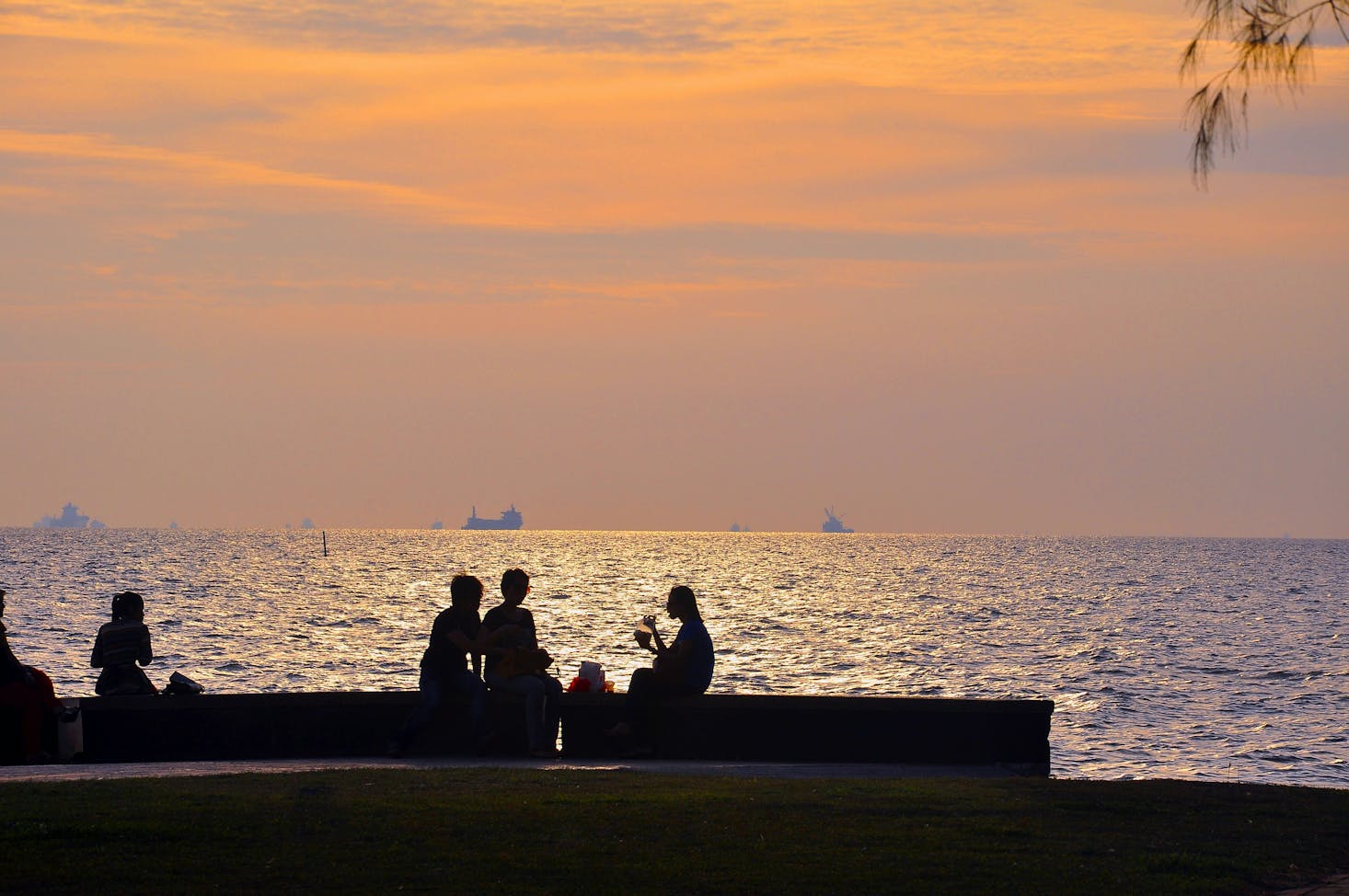 Morib Beach near Kuala Lumpur at sunset with people eating by the water