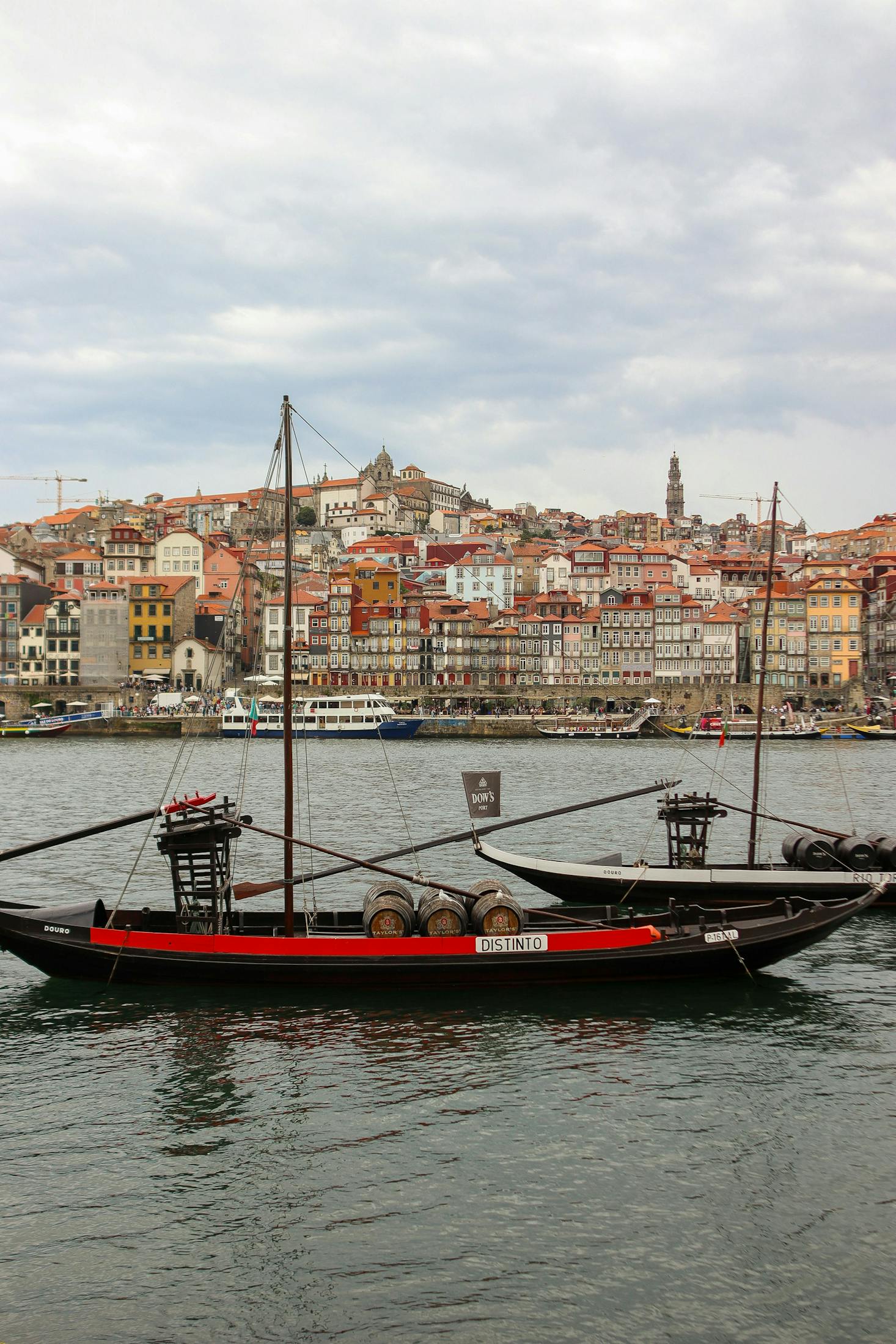 Two boats with a building backdrop in Vila Nova de Gaia near Porto