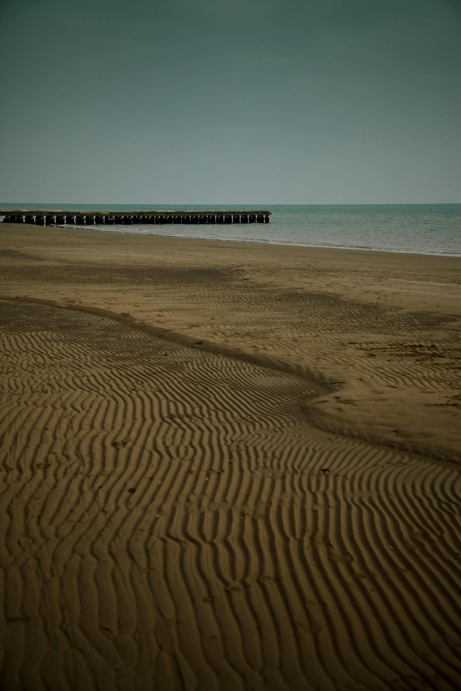 The combed sand of Lido di Jesolo on a stormy day