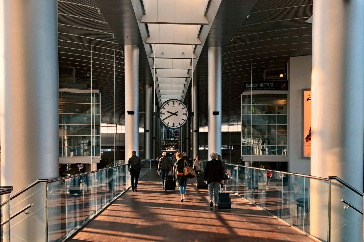 Passengers with their luggage walking through the Copenhagen Airport, Kastrup 