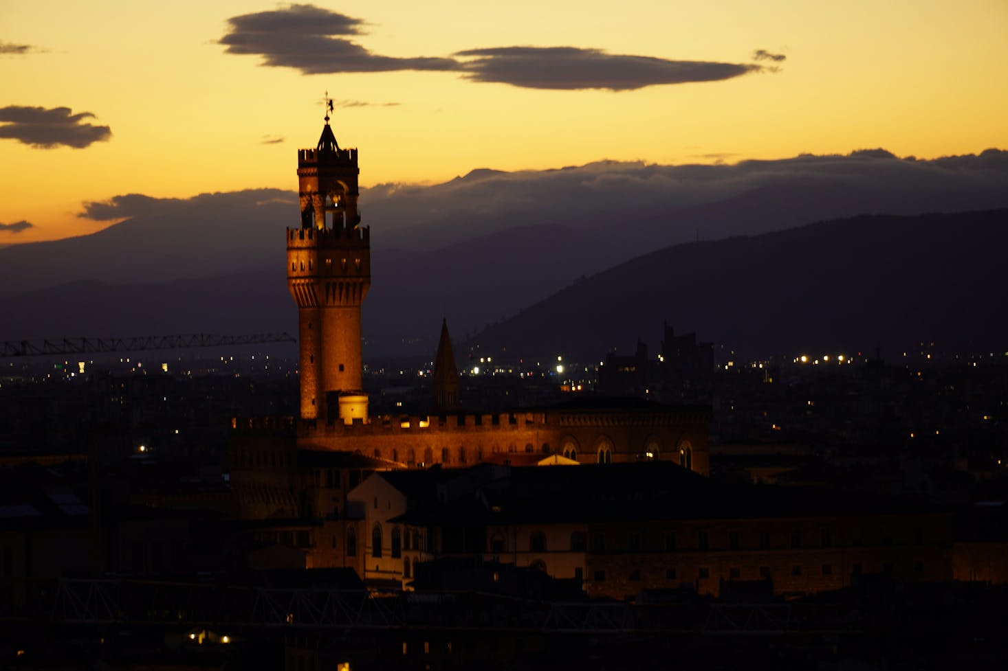 A tower silhouette at sunset in Florence