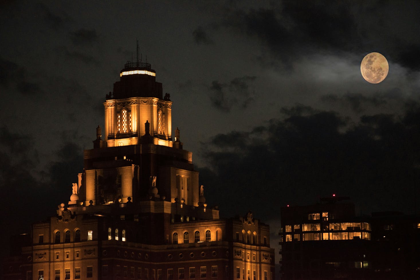 Historic Philadelphia building at night lit up by the moon