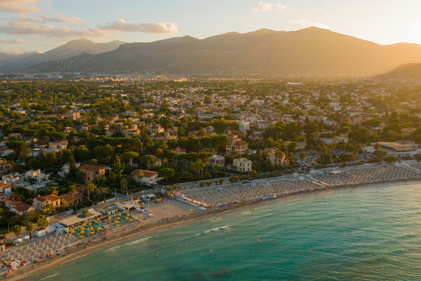 An aerial sunset view of Mondello Beach in Palermo