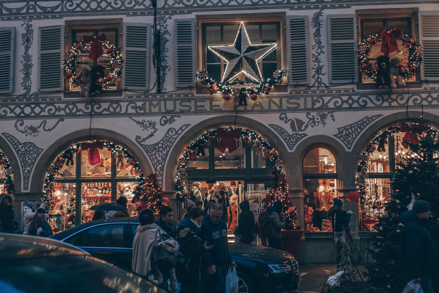 An illimated shop at night in Colmar at Christmas time 