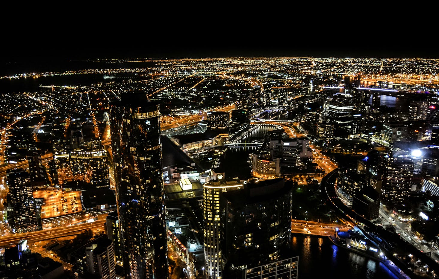 Aerial view of the Melbourne CBD lit up at night