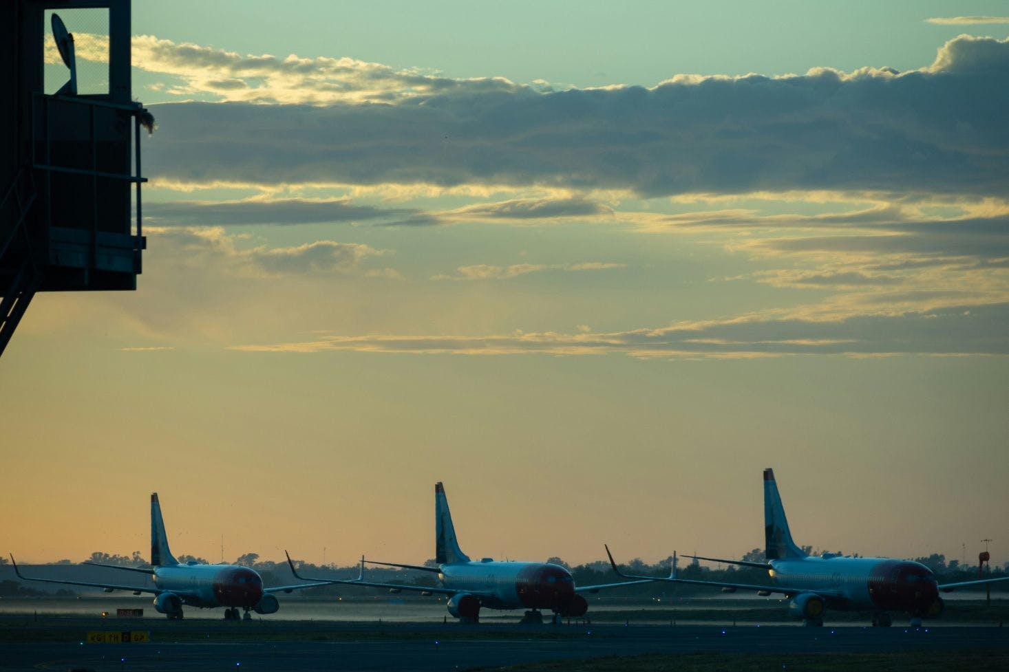 Three planes at dawn on the tarmac of Ezeiza International Airport (EZE), Argentina 