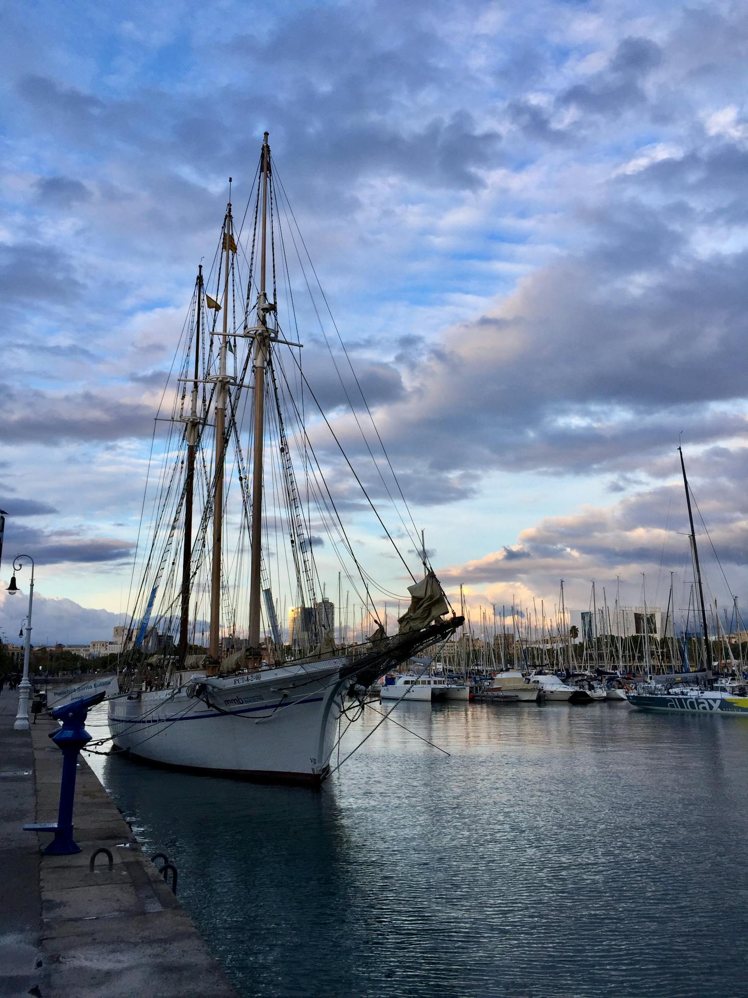 Sailboat in the harbor near Barcelona Port