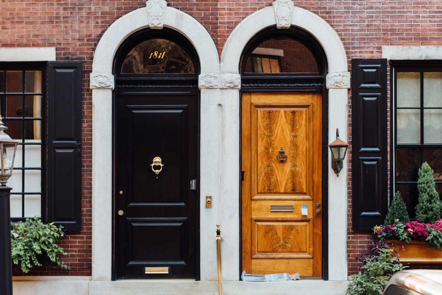 Two old-fashioned doorways with arched white trim in Philadelphia's Old City