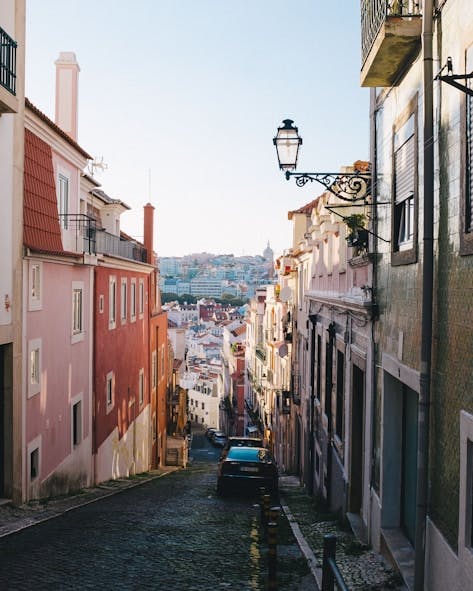 Narrow downhill street in Lisbon Narrow downhill street in Lisbon