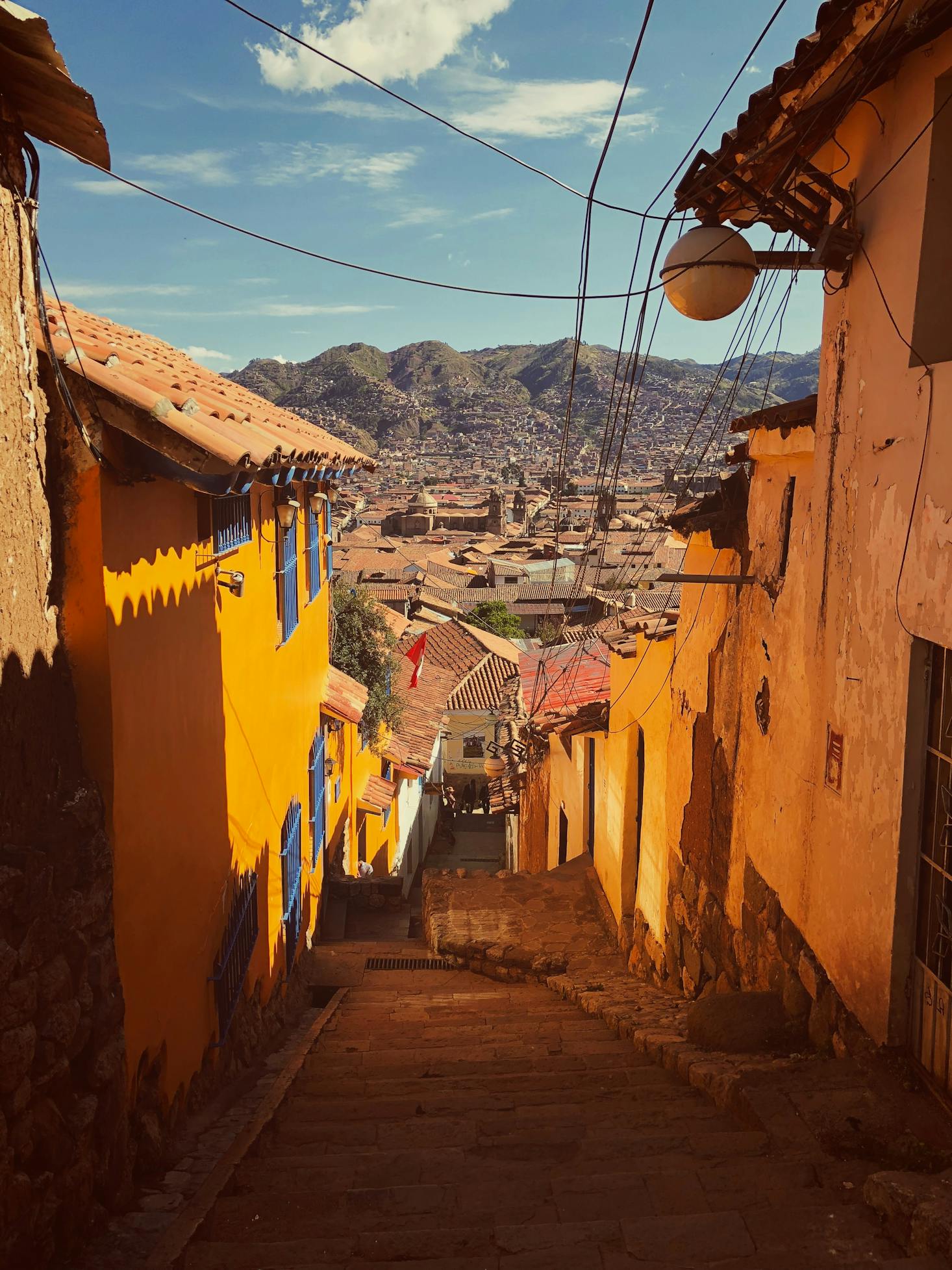 Narrow steps surrounding by houses leading to the city center of Cusco, Peru