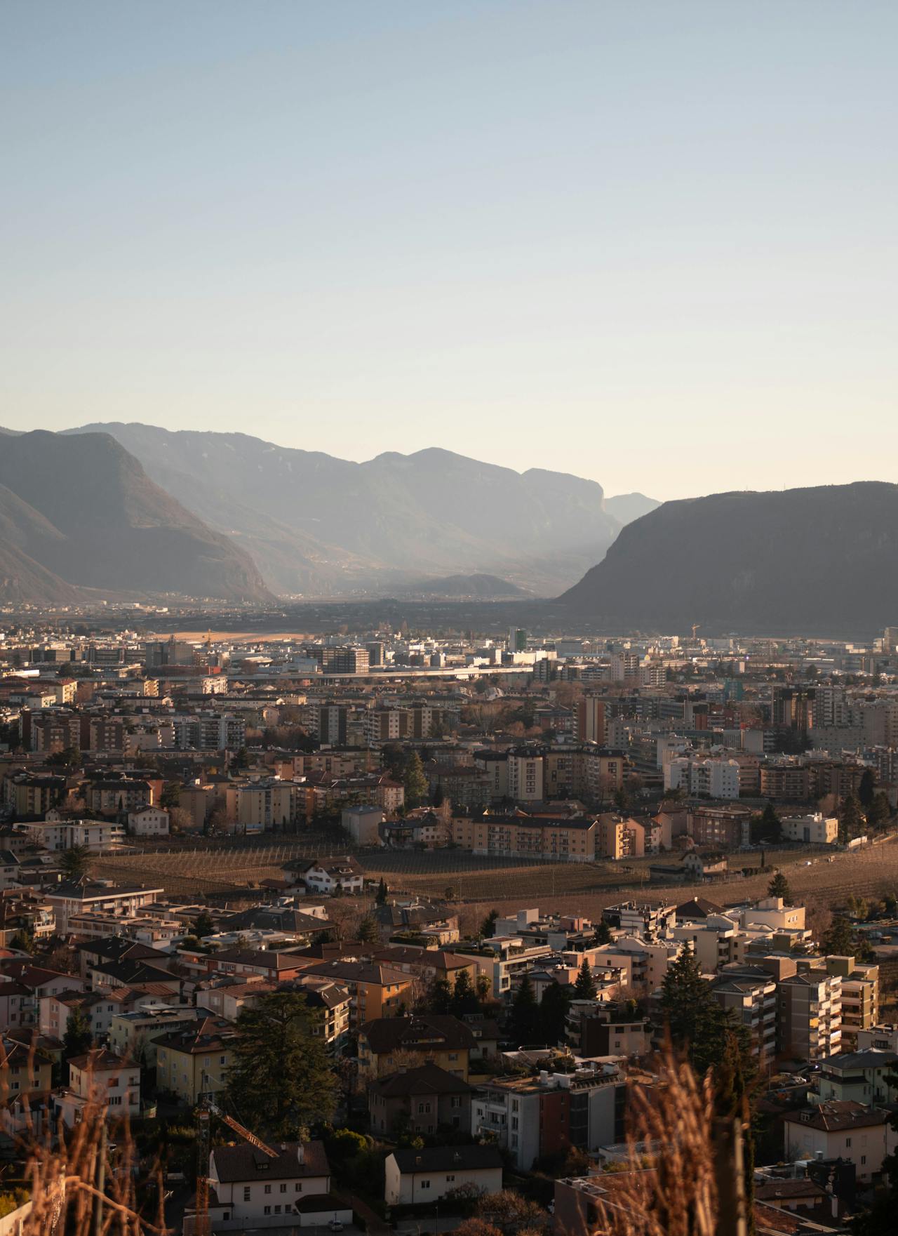 Aerial view over Bolzano with surrounding Dolomite mountains Aerial view over Bolzano with surrounding Dolomite mountains