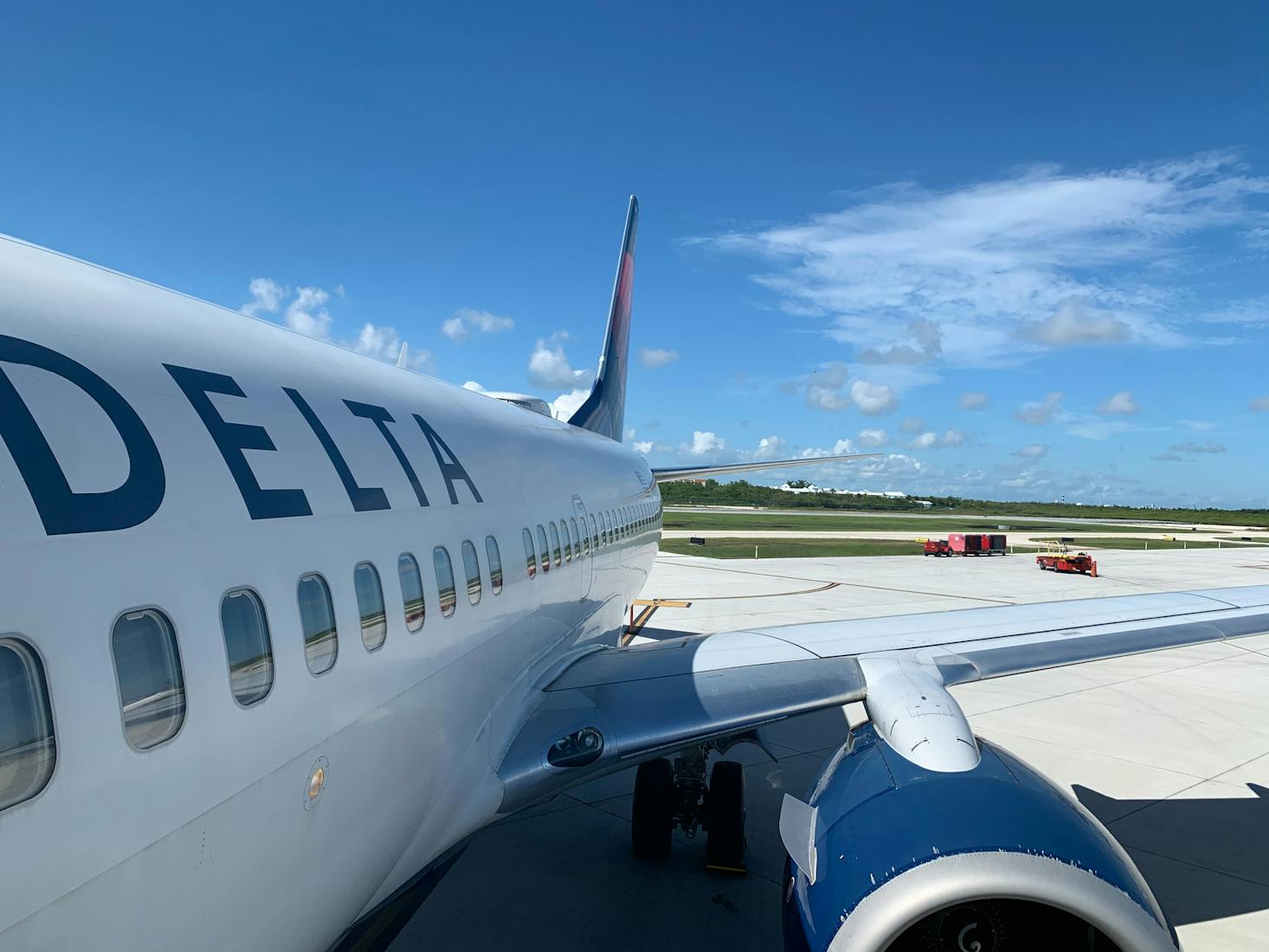 A plane parked at Key West Airport in Florida on a sunny day