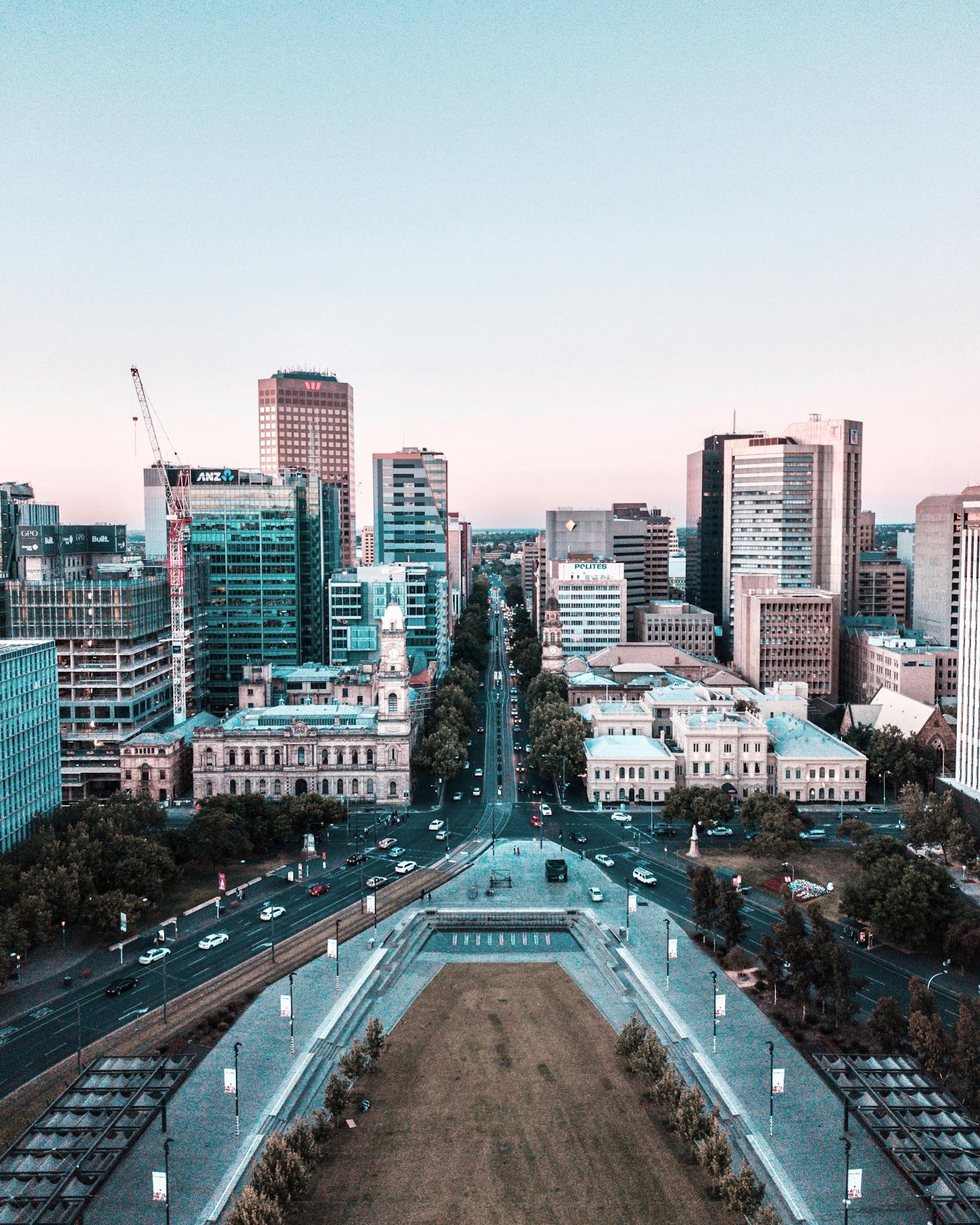 The city skyline of Adelaide, Australia with green spaces in the foreground