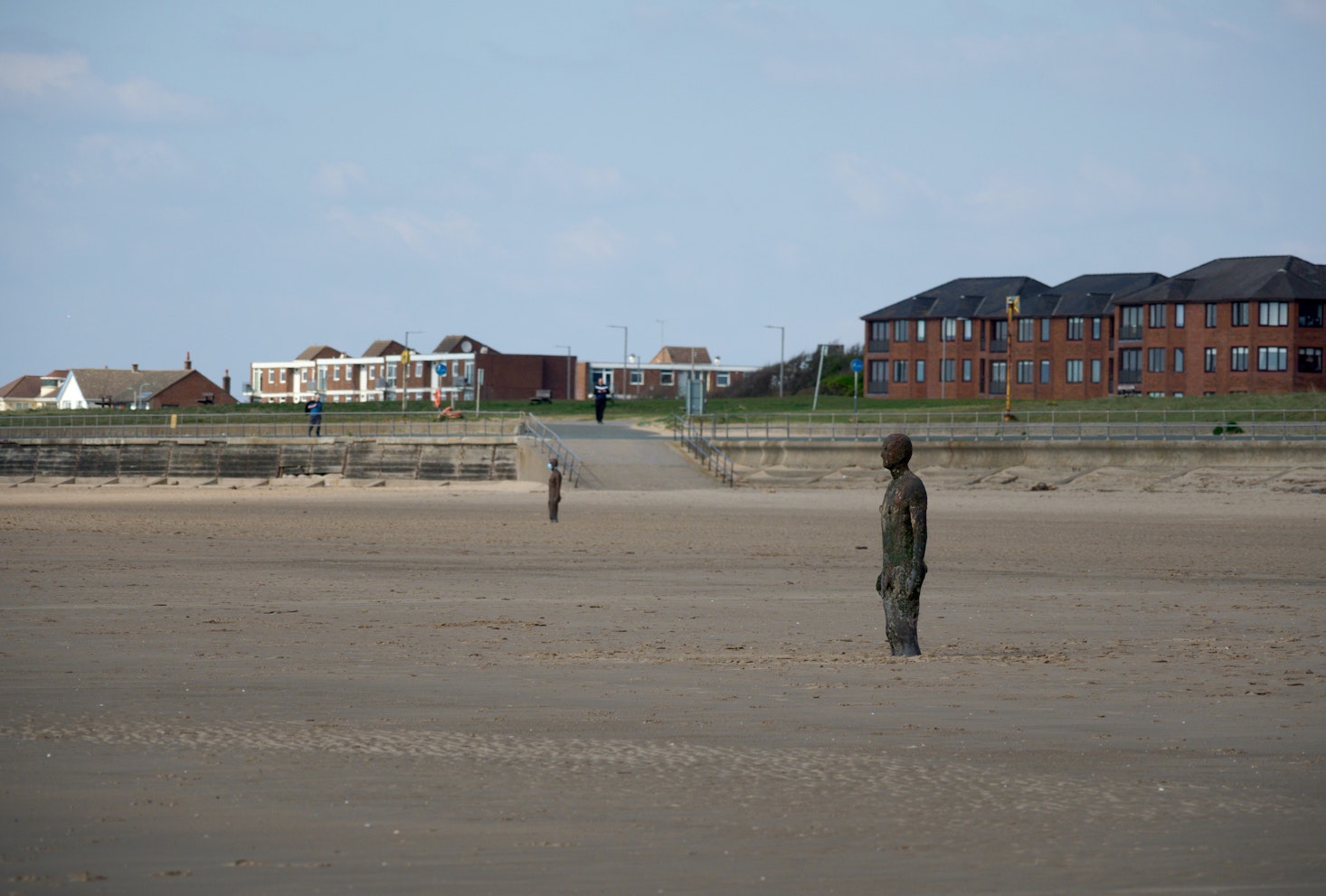 Sandy Crosby Beach in Liverpool with an iron statue of a man