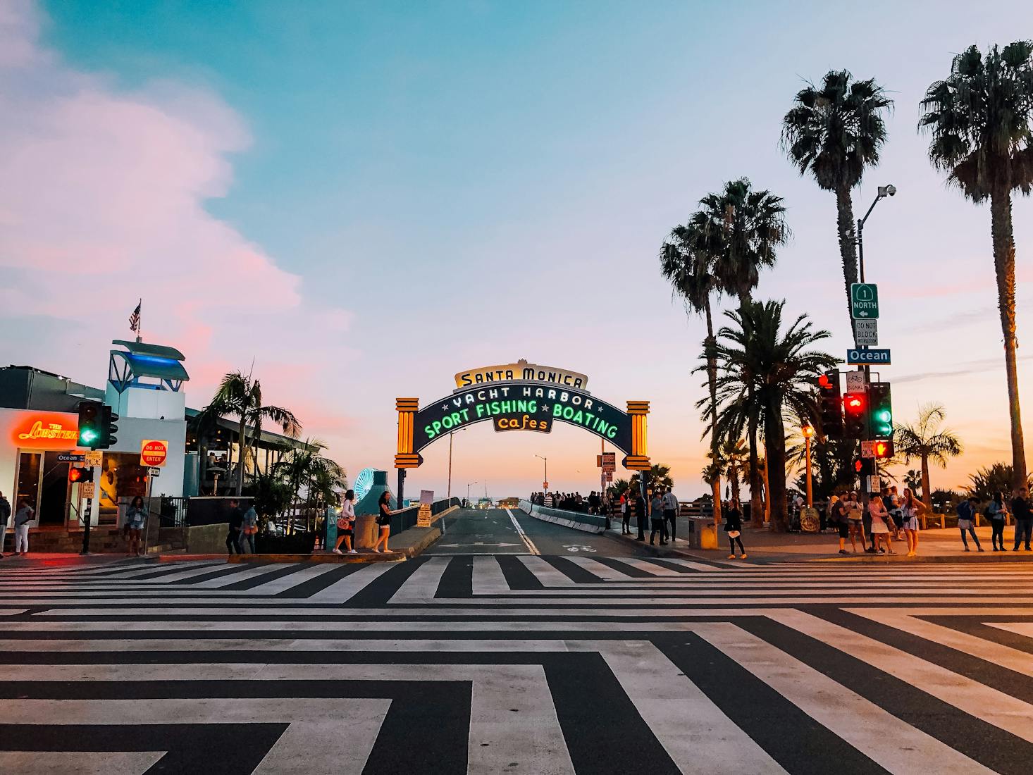 Neon sign in Santa Monica on the main street lined with palm trees