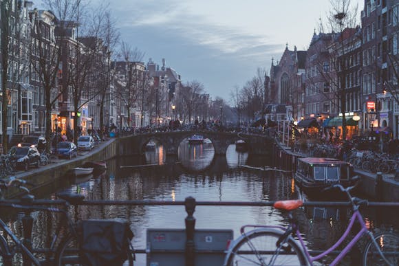 A darkly lit canal in Amsterdam's city center