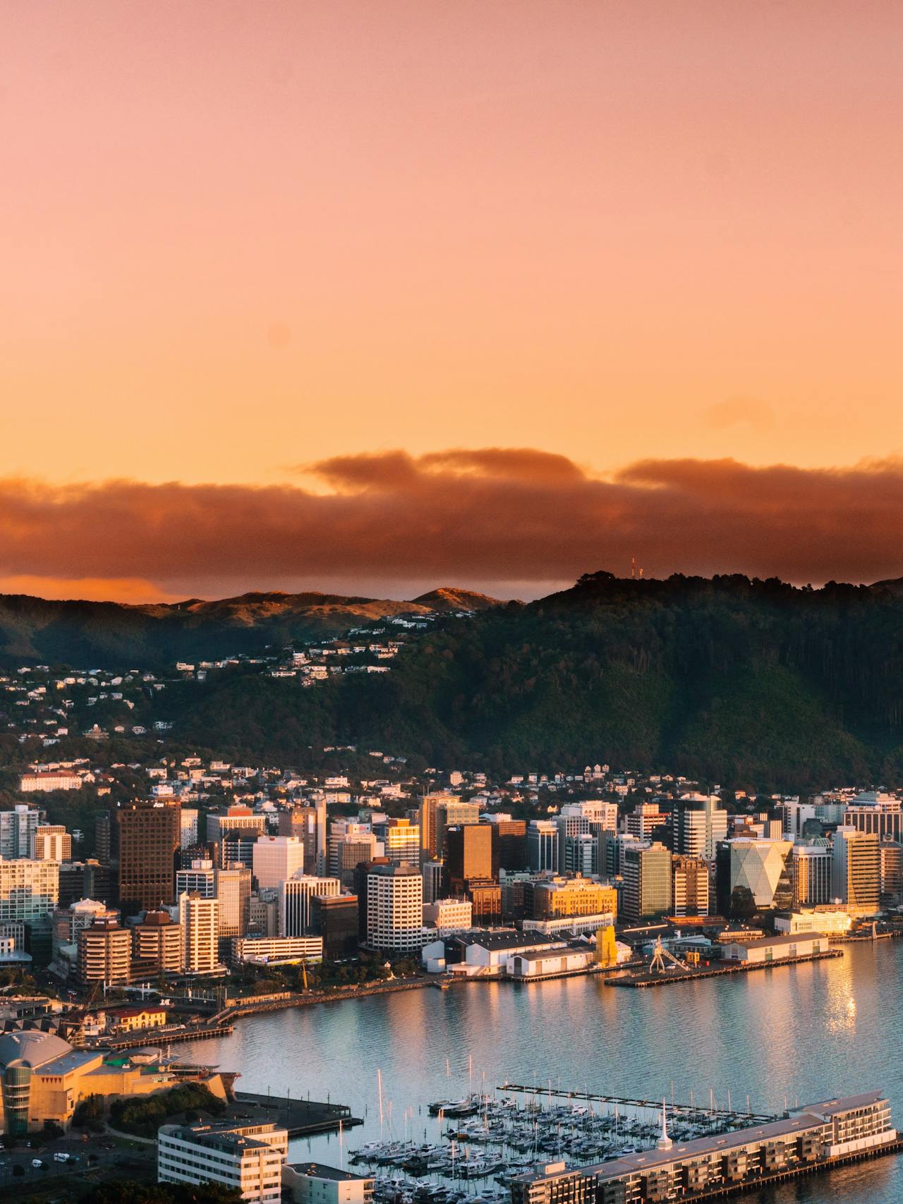 Wellington center at sunset with mountains in the distance Wellington center at sunset with mountains in the distance