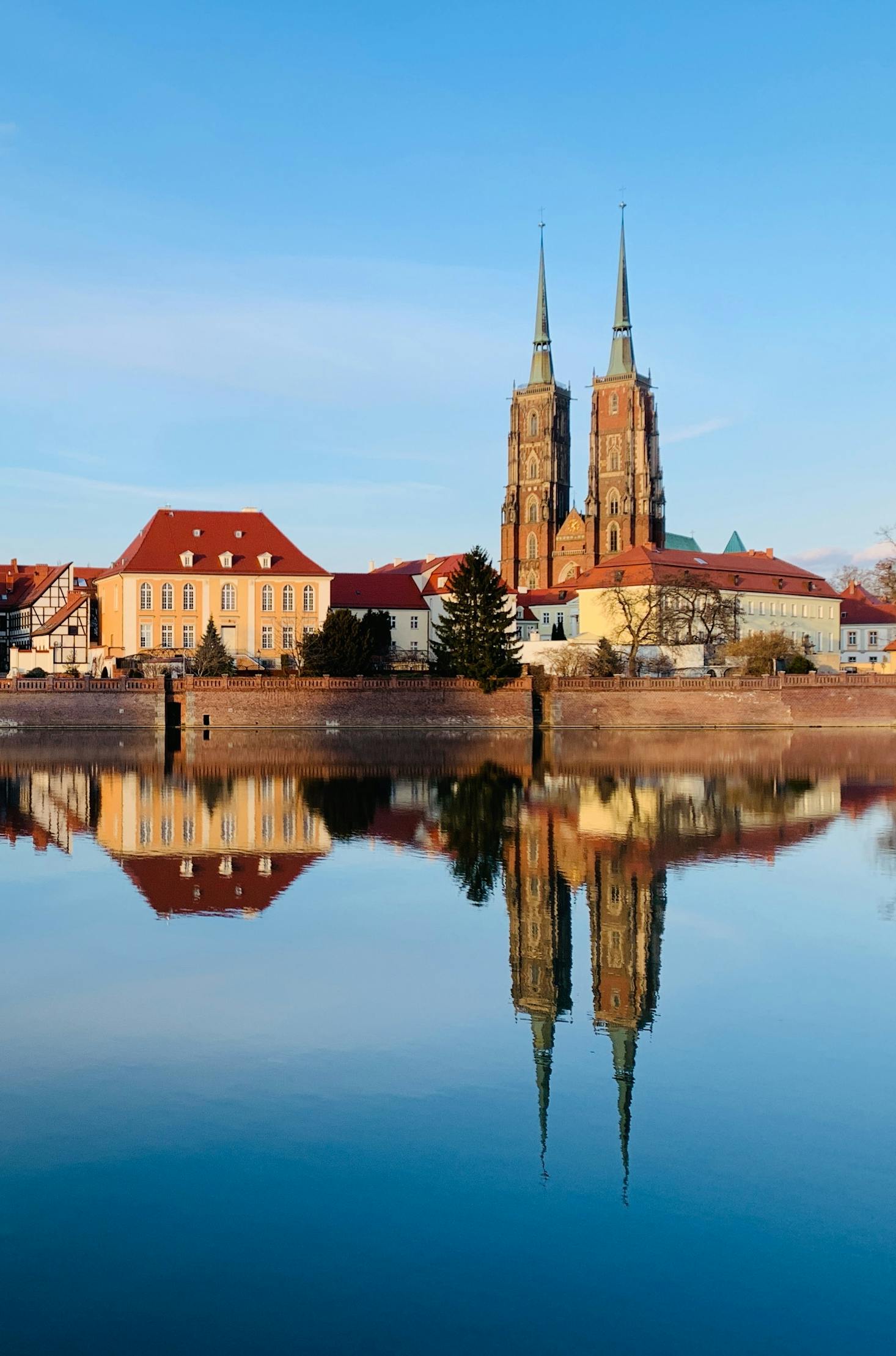 Buildings in Wroclaw, Poland reflect against the Odra River