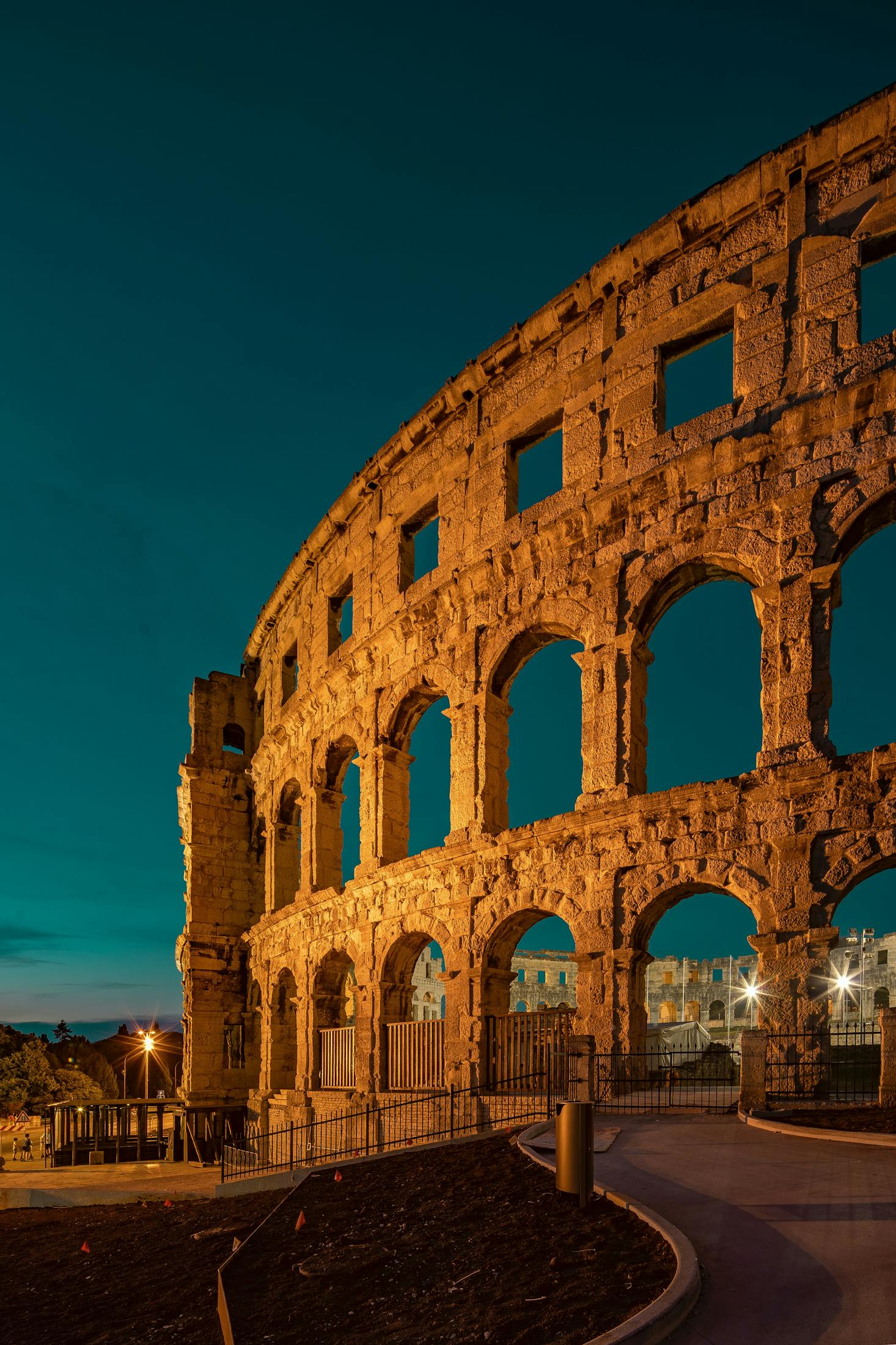 An ancient structure in Pula, Croatia framed against a blue sky