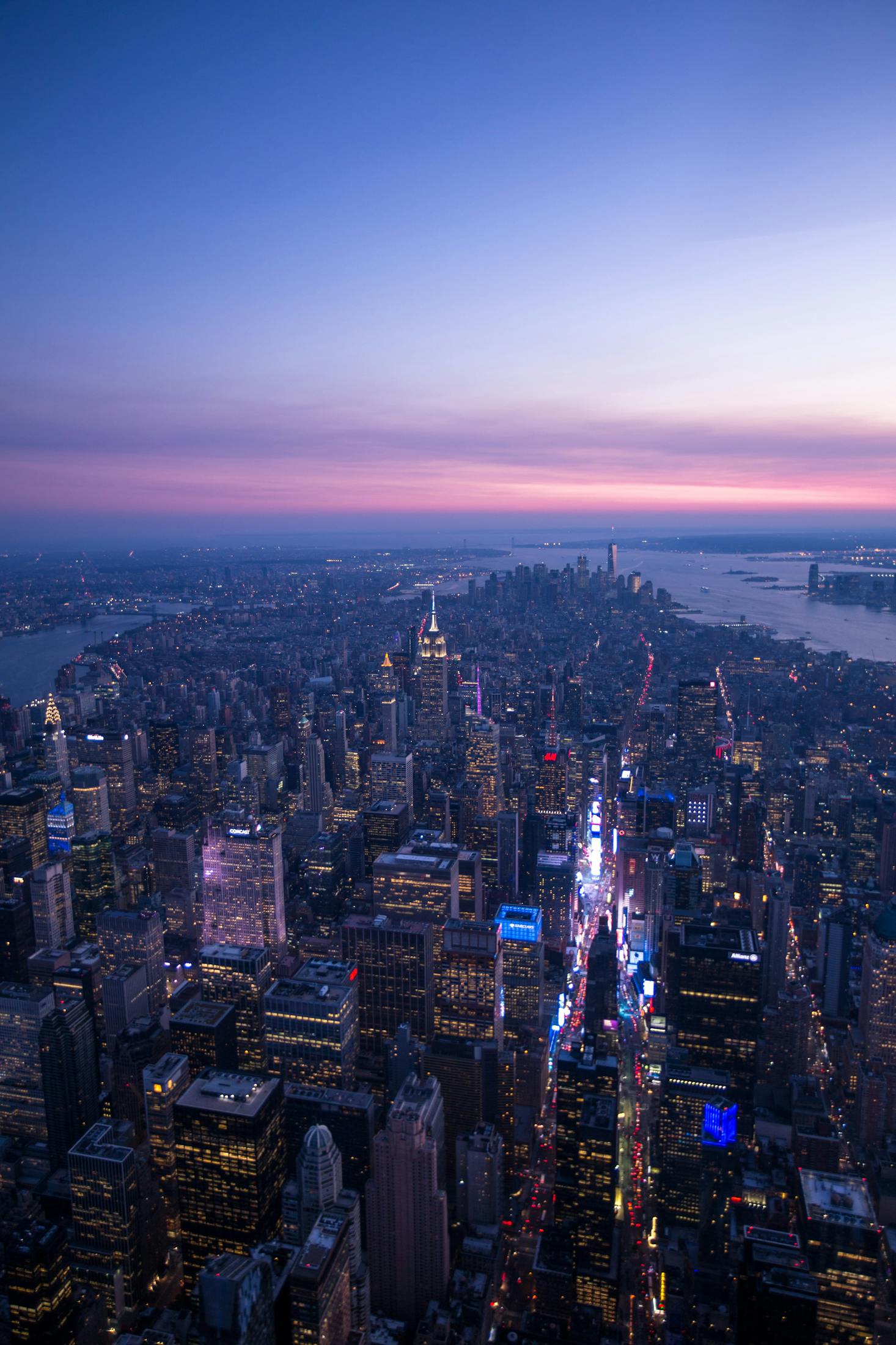 NYC skyline at sunset with the Manhattan Cruise Terminal in the distance