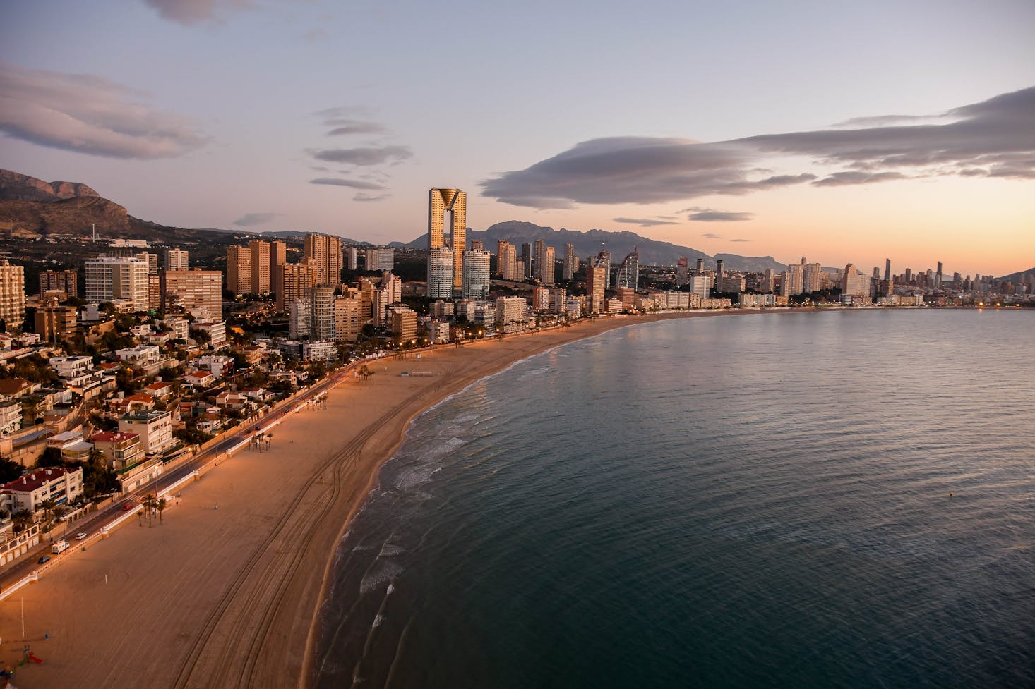 The skyline of Benidorm, Spain against a backdrop of sunset skies