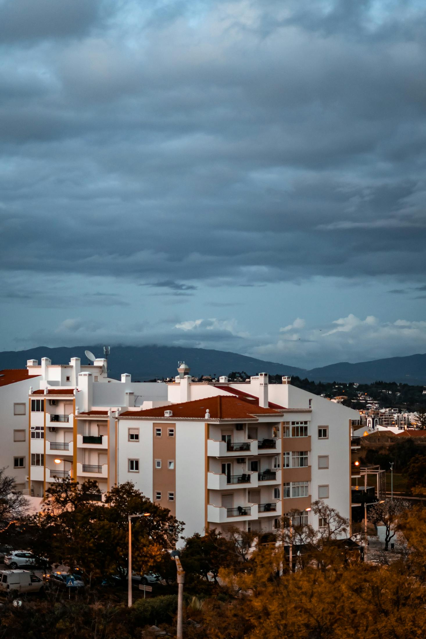 White stucco buildings framed against a blue sky in Lagos, Portugal