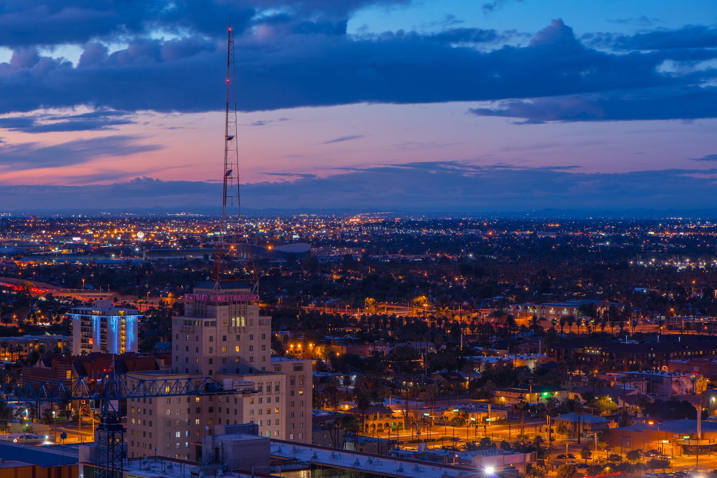 Aerial view of Phoenix in the evening with a pink and purple sky