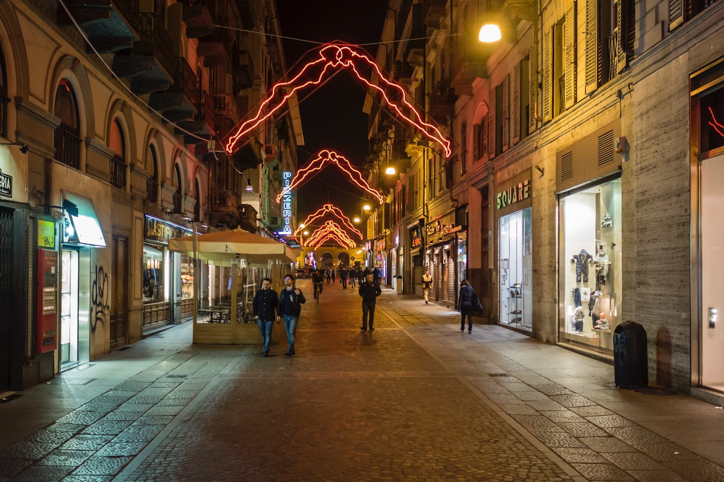 A shopping street in Turin at night with twinkle lights