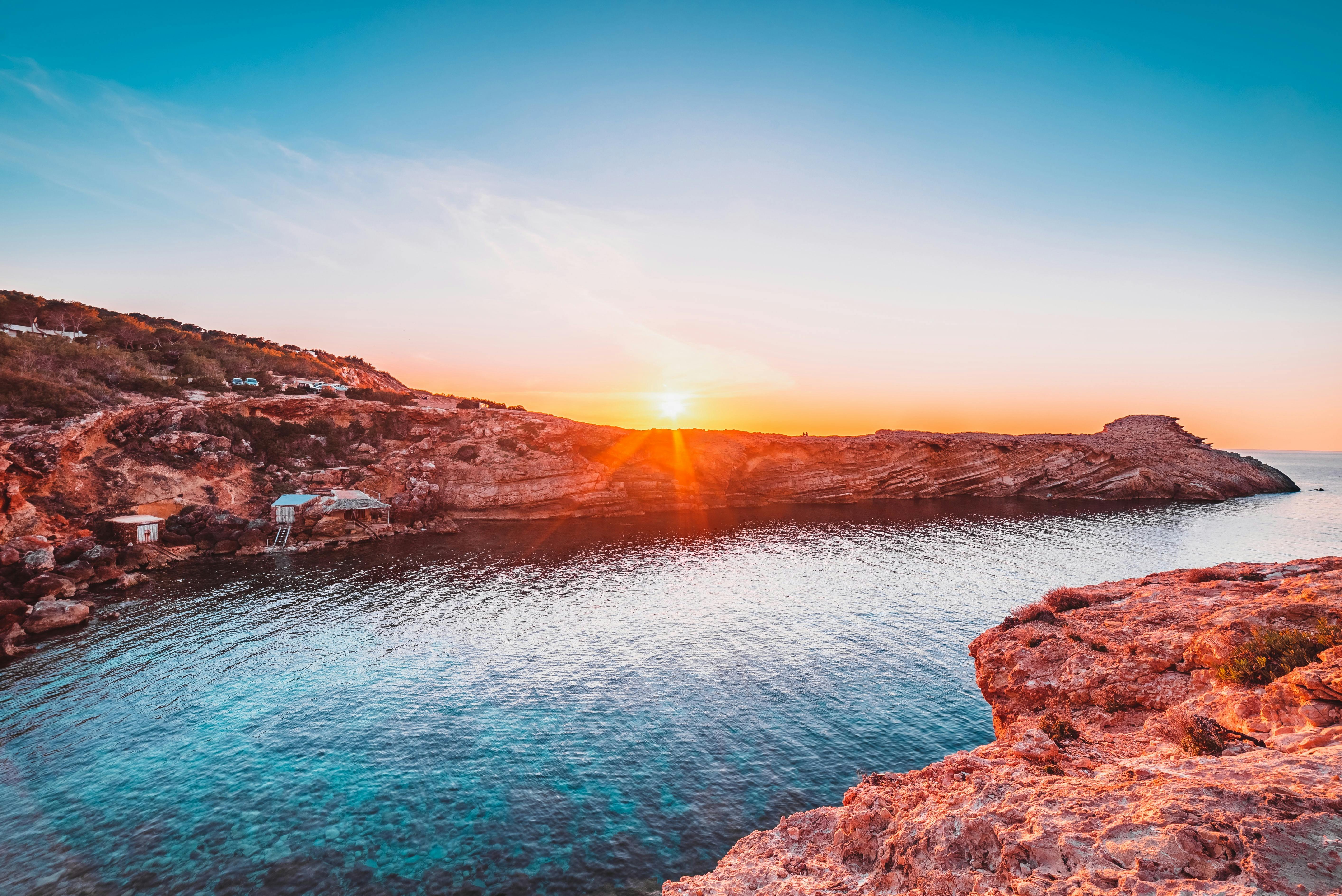 sunset over a rocky cove