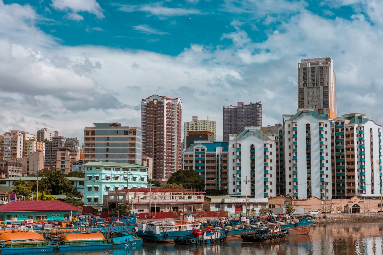 A morning layover in Manila with tall buildings and water views