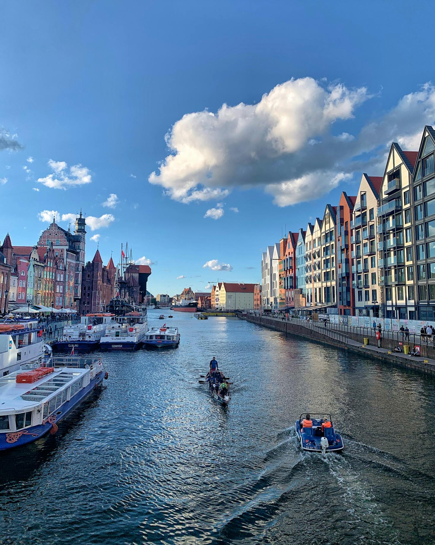 A waterway in Gdansk, Poland with colorful buildings on either side