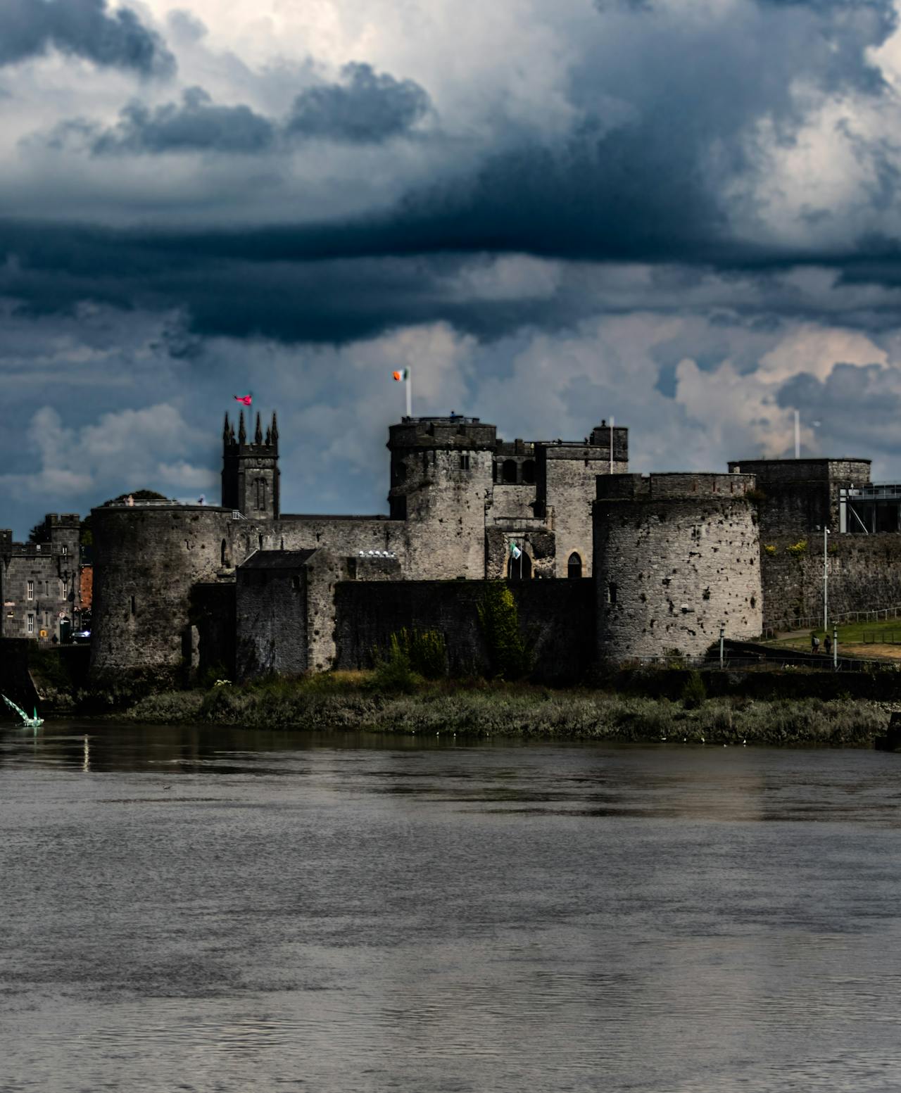 The ominous gray stone King John's Castle on a stormy day in Limerick The ominous gray stone King John's Castle on a stormy day in Limerick