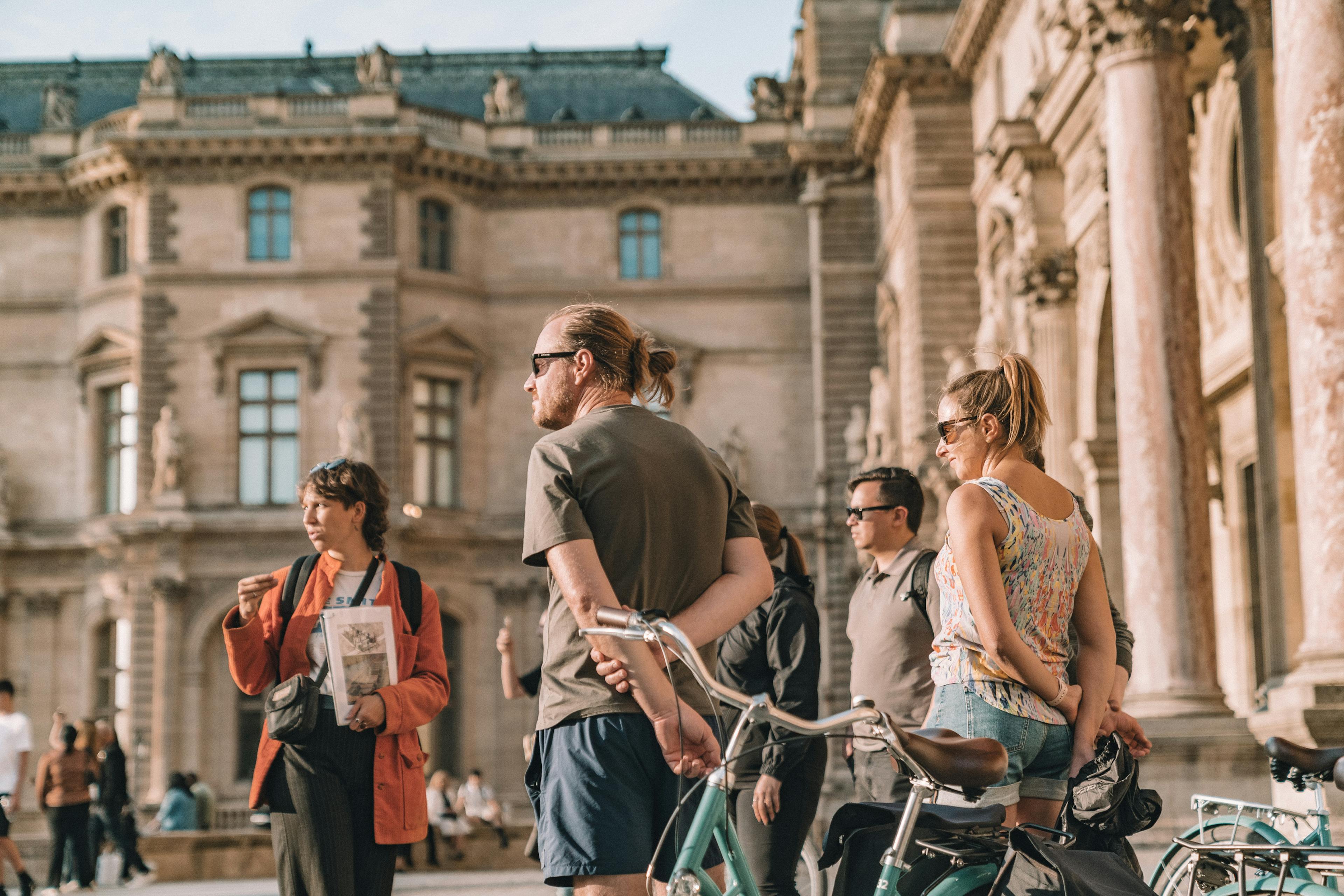 bike at night - Louvre at Sunset Group - Boutique Tours Paris Evening Bike and Boat Tour