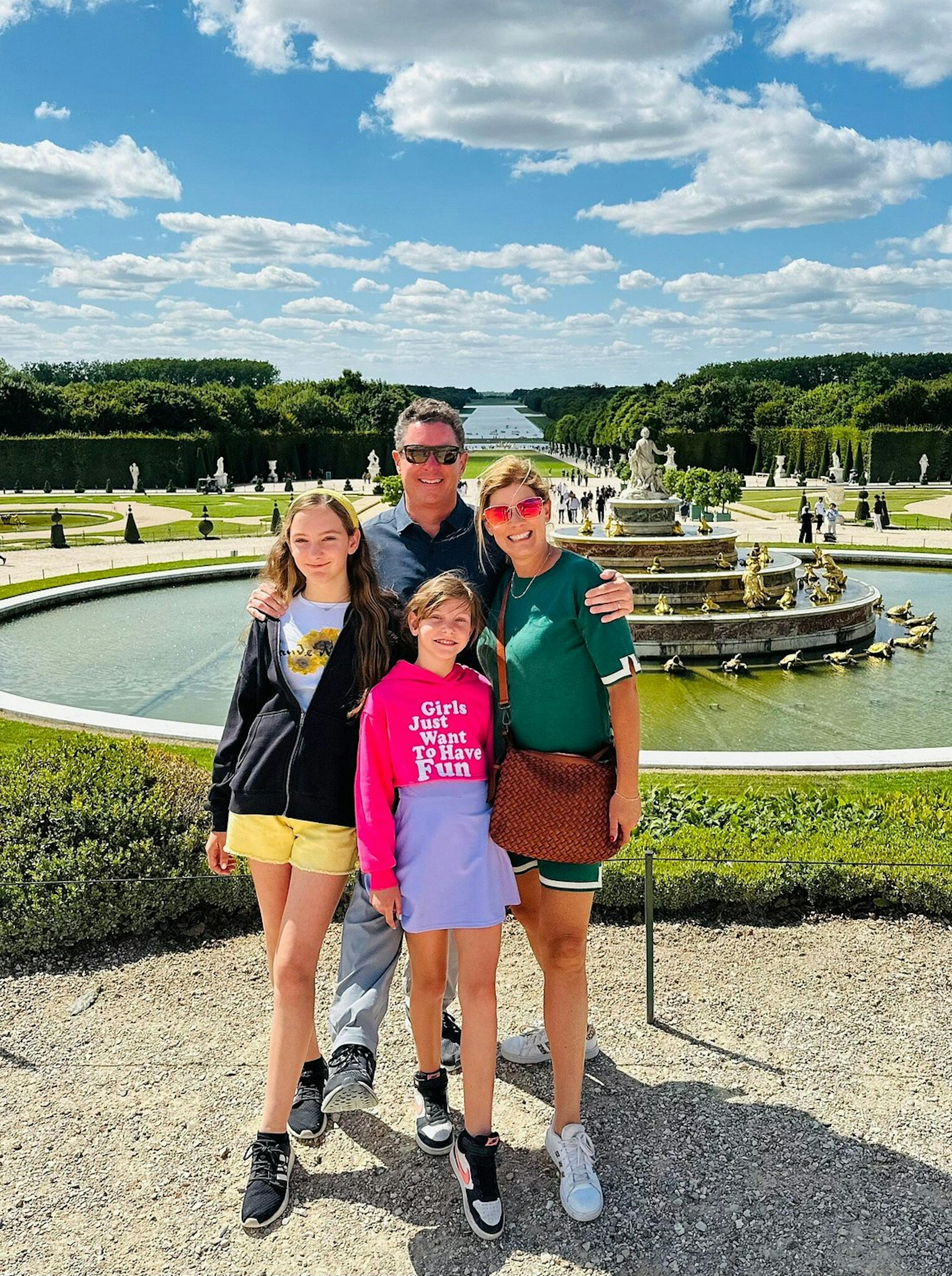 Family of four in the gardens of Versailles