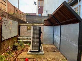 Air source heat pump and noise barrier