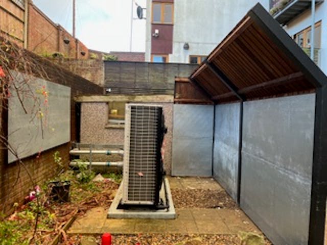 Air source heat pump and noise barrier 