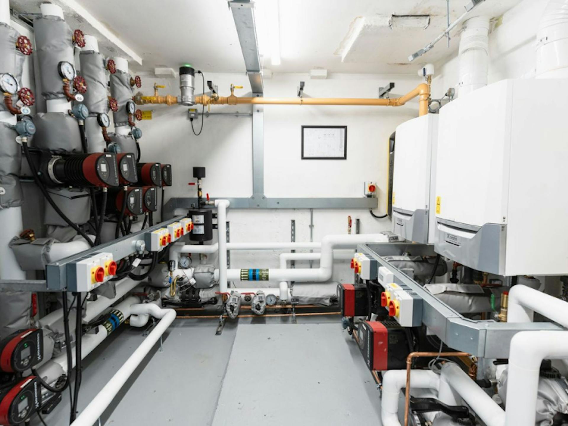 Refurbished plantroom with boilers and pipework