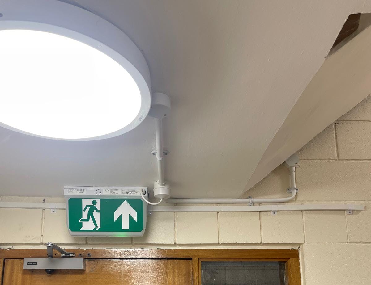 Circular ceiling light and emergency exit sign