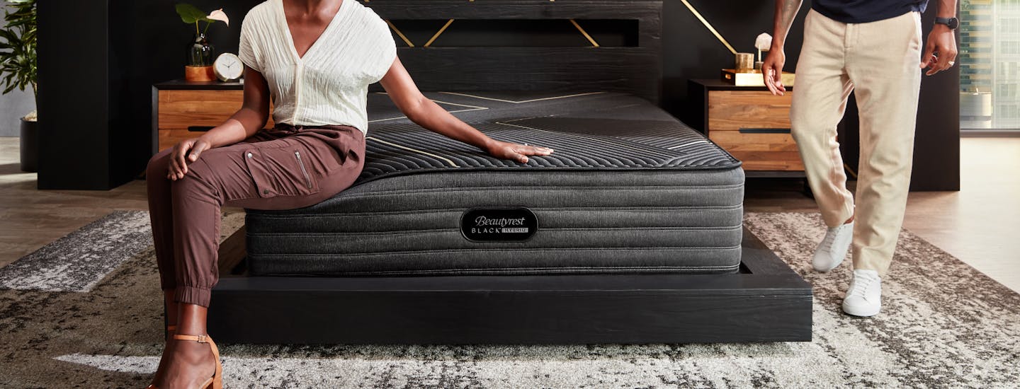 Woman sitting on Beautyrest Black Mattress