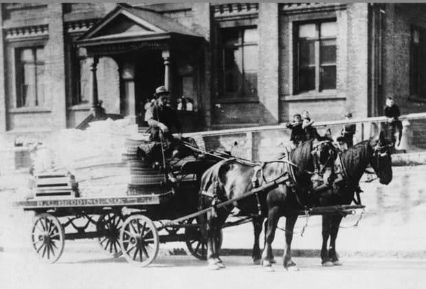 Black and white photo of a horse and buggy