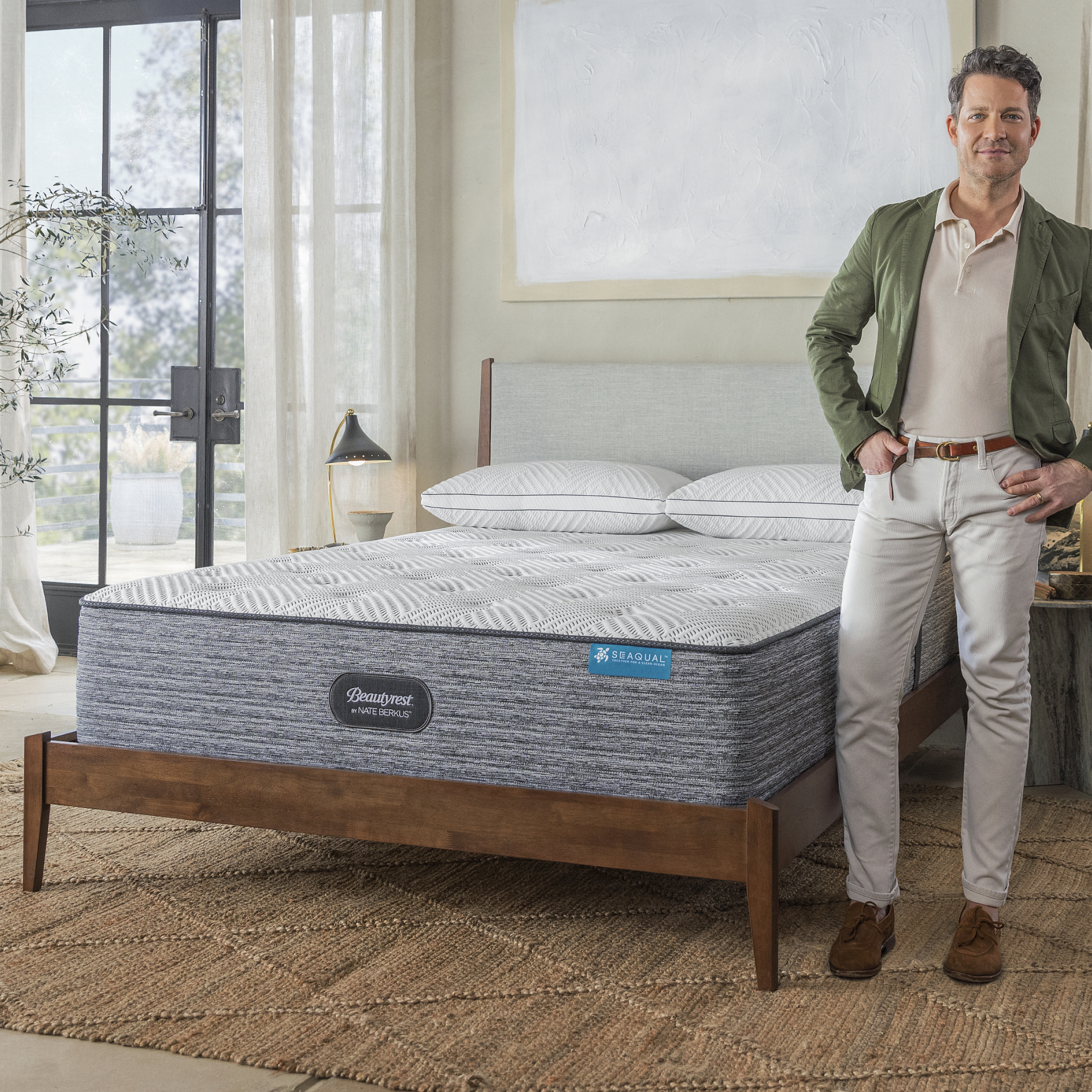 Nate Berkus standing next to the Beautyrest Nate Berkus Limited Edition Mattress