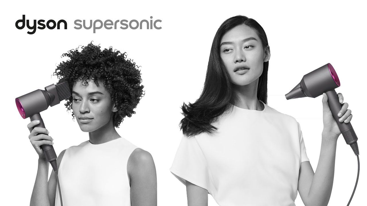Image from Dyson of two women using the Supersonic hair dryer