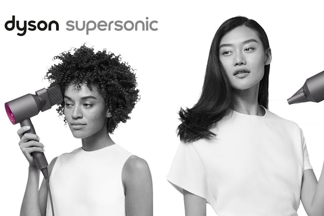 Image from Dyson of two women using the Supersonic hair dryer