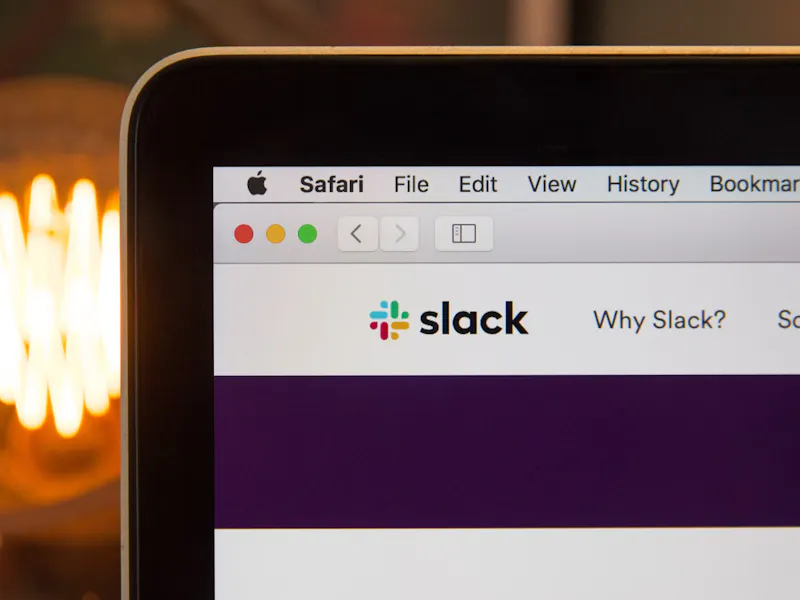 Picture of the Slack logo on a laptop screen