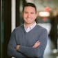 business professional in a gray sweater, headshot